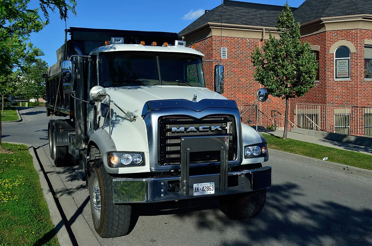 White Mack Granite dump truck photographed from the front