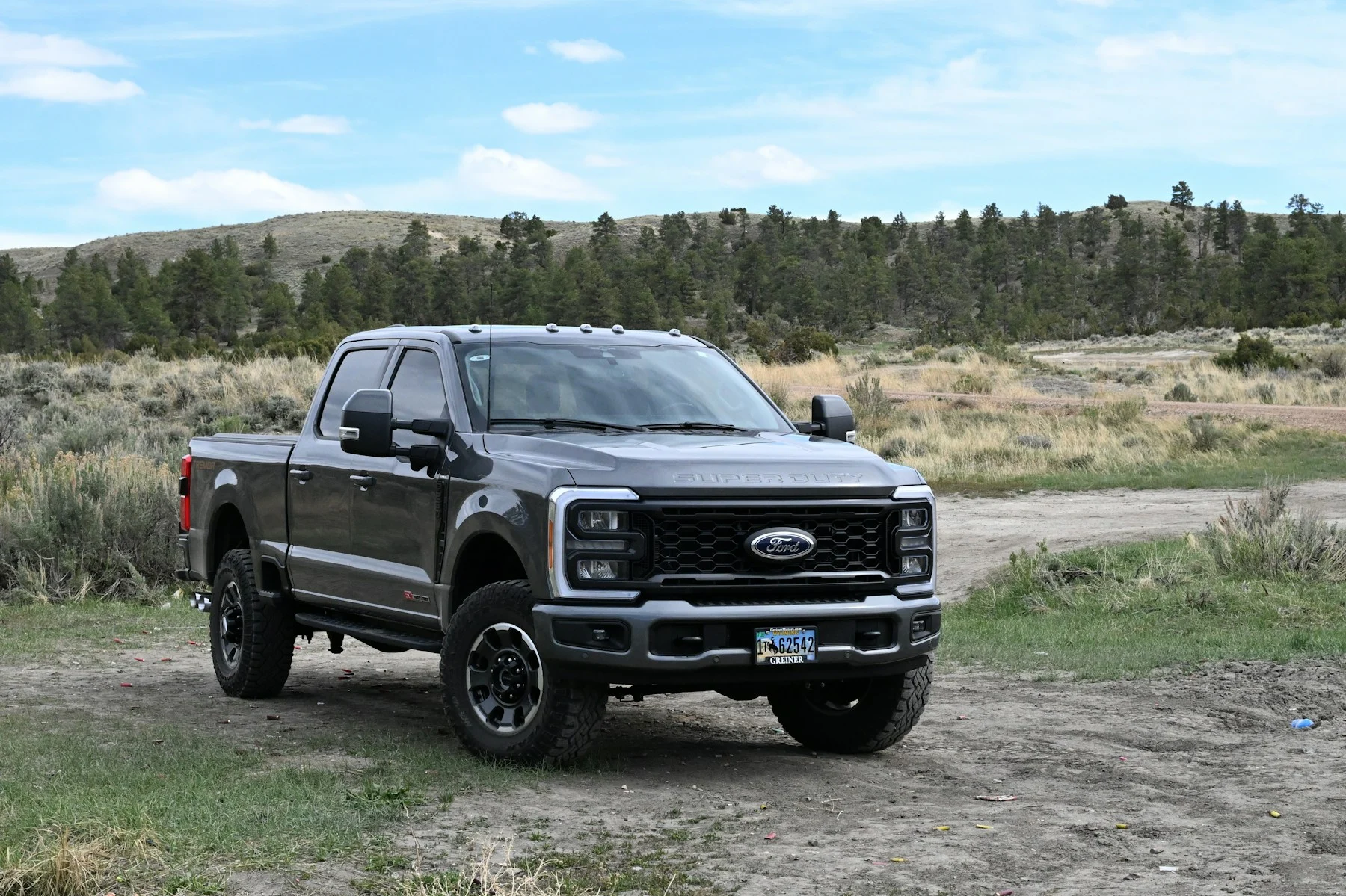 Gray Ford Super Duty pickup on a rural road
